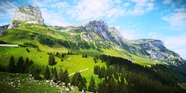 蓝天白云绿色瑞士山脉风光摄影图片