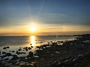 黄昏海岸落日残阳图片