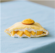 芒果味舒芙蕾点心摄影图片